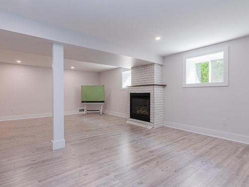 Basement - 745 101E Avenue, Laval (Chomedey), QC - Indoor With Fireplace