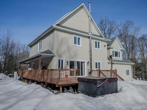 Back facade - 1136 Ch. Du Lac-Connelly, Saint-Hippolyte, QC - Outdoor With Deck Patio Veranda With Exterior