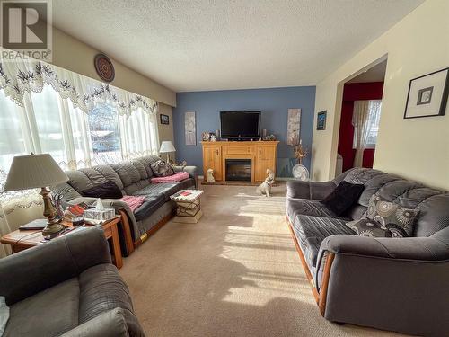 1064 93 Avenue, Dawson Creek, BC - Indoor Photo Showing Living Room With Fireplace