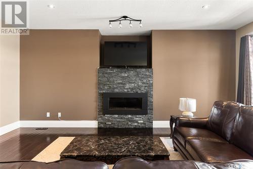 15 Emerald Hill Drive, White City, SK - Indoor Photo Showing Living Room With Fireplace
