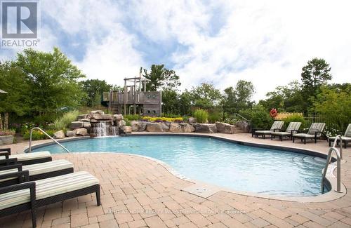 410 - 120 Carrick Trail, Gravenhurst, ON - Outdoor With In Ground Pool With Backyard