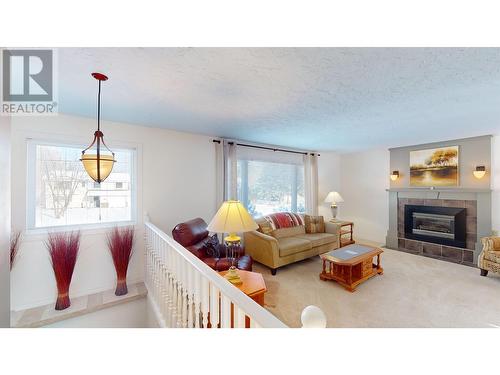 1757 Cypress Road, Quesnel, BC - Indoor Photo Showing Living Room With Fireplace