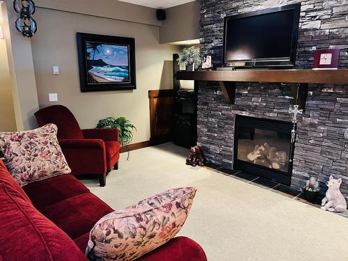 2 - 2600 Riverrock Way, Invermere, BC - Indoor Photo Showing Living Room With Fireplace