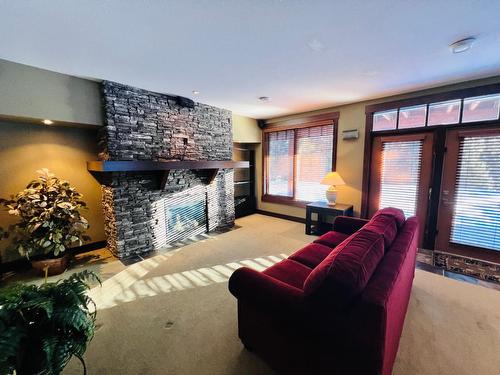 2 - 2600 Riverrock Way, Invermere, BC - Indoor Photo Showing Living Room With Fireplace