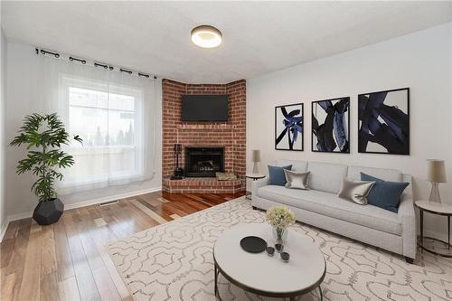 4535 St. Volodymyr Crescent, Beamsville, ON - Indoor Photo Showing Living Room With Fireplace