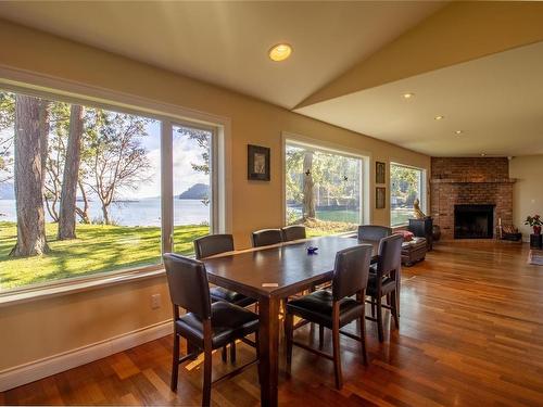 4246 Armadale Rd, Pender Island, BC - Indoor Photo Showing Dining Room With Fireplace