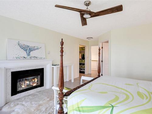 3370 Haida Dr, Colwood, BC - Indoor Photo Showing Bedroom With Fireplace