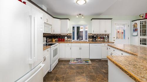 304 Dugan Street, Creston, BC - Indoor Photo Showing Kitchen With Fireplace