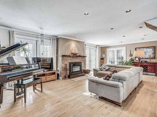 Living room - 235 Av. Martin, Dorval, QC - Indoor Photo Showing Living Room With Fireplace