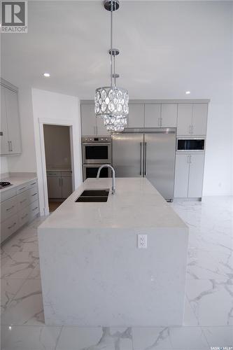 4406 Wolf Willow Place, Regina, SK - Indoor Photo Showing Kitchen With Double Sink