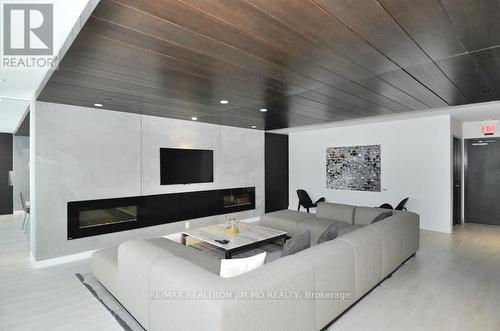 #708 -55 Regent Park Blvd, Toronto, ON - Indoor Photo Showing Living Room With Fireplace