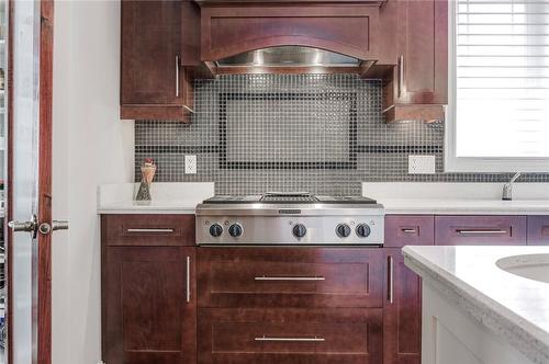 Custom Maple cabinets and gas stovetop with grill - 4072 Highland Park Drive, Beamsville, ON - Indoor Photo Showing Kitchen