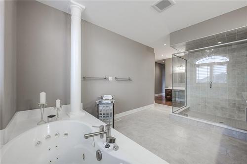Soaker tub and separate glass shower - 4072 Highland Park Drive, Beamsville, ON - Indoor Photo Showing Bathroom