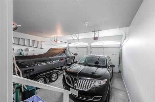 Double garage large enough to store your boat! - 4072 Highland Park Drive, Beamsville, ON - Indoor Photo Showing Garage