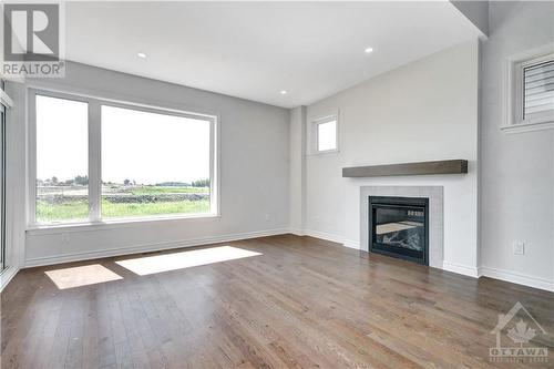 50 Whooping Crane Ridge, Ottawa, ON - Indoor Photo Showing Living Room With Fireplace