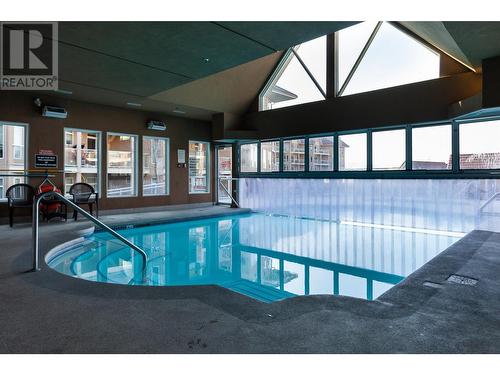 1088 Sunset Drive Unit# 434, Kelowna, BC - Indoor Photo Showing Other Room With In Ground Pool