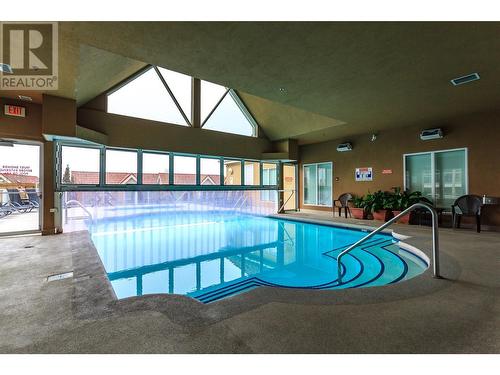 1088 Sunset Drive Unit# 434, Kelowna, BC - Indoor Photo Showing Other Room With In Ground Pool