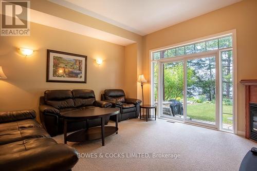 #7 -1579 Anstruther Lake Rd, North Kawartha, ON - Indoor Photo Showing Living Room With Fireplace