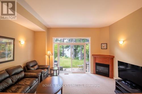 #7 -1579 Anstruther Lake Rd, North Kawartha, ON - Indoor Photo Showing Living Room With Fireplace