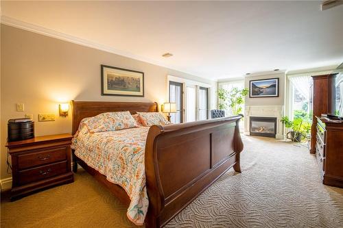 6034 Mountainside Street, Niagara Falls, ON - Indoor Photo Showing Bedroom With Fireplace