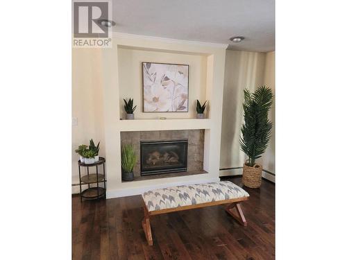 1716 Cedarwood Court, Dawson Creek, BC - Indoor Photo Showing Living Room With Fireplace