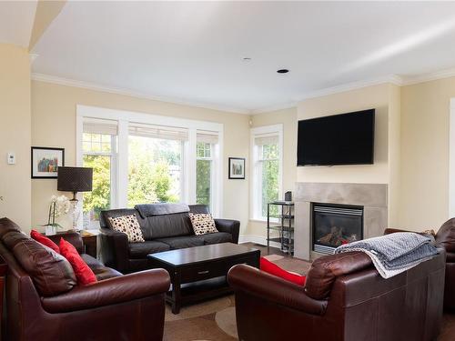 103-2060 Troon Crt, Langford, BC - Indoor Photo Showing Living Room With Fireplace