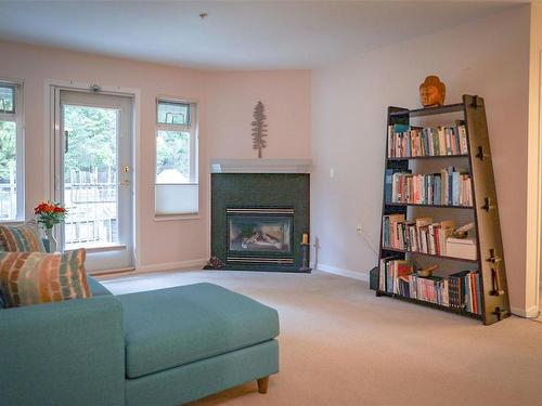 209-500 Argyle Lane, Gabriola Island, BC - Indoor Photo Showing Living Room With Fireplace