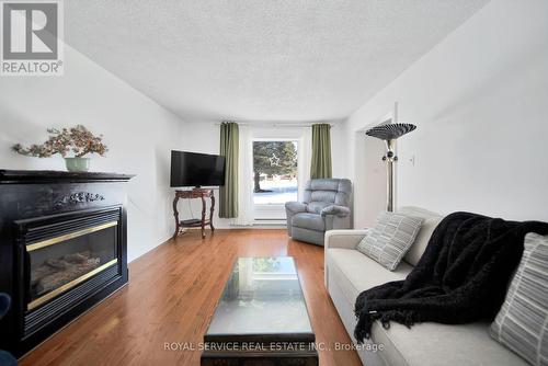 199 Clitheroe Road, Alnwick/Haldimand, ON - Indoor Photo Showing Living Room With Fireplace