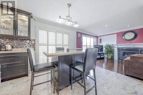 27 Crowsnest Cres, Brampton, ON - Indoor Photo Showing Dining Room With Fireplace