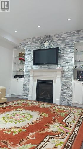 31 Arthur Mclaughing St, Clarington, ON - Indoor Photo Showing Living Room With Fireplace