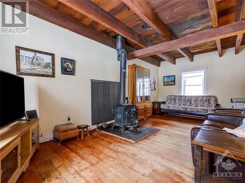 Family room with wood stove & open beam ceilings - 841 Old Union Hall Road, Almonte, ON - Indoor