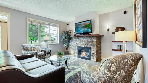 512C - 500 Bighorn Boulevard, Radium Hot Springs, BC - Indoor Photo Showing Living Room With Fireplace