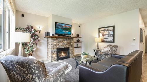 512C - 500 Bighorn Boulevard, Radium Hot Springs, BC - Indoor Photo Showing Living Room With Fireplace