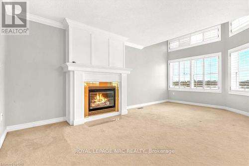 9 - 88 Lakeport Road, St. Catharines, ON - Indoor With Fireplace