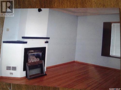 502 1St Street W, Meadow Lake, SK - Indoor Photo Showing Other Room With Fireplace