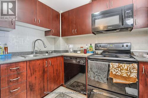 #505 -6720 Glen Erin Dr, Mississauga, ON - Indoor Photo Showing Kitchen With Double Sink