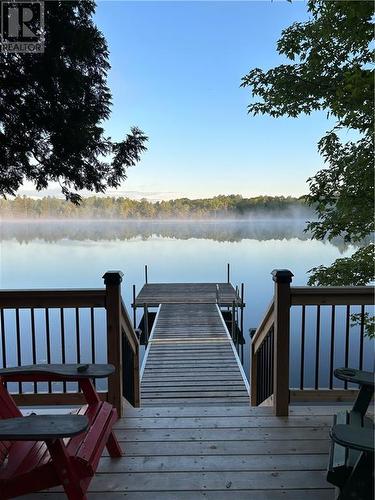 Summer view with docks - 357 Clear Lake Lane 11 Road, Maberly, ON - Outdoor With Body Of Water