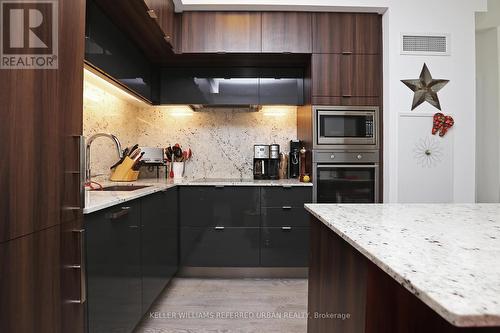 #335 -15 Merchants' Wharf, Toronto, ON - Indoor Photo Showing Kitchen With Upgraded Kitchen