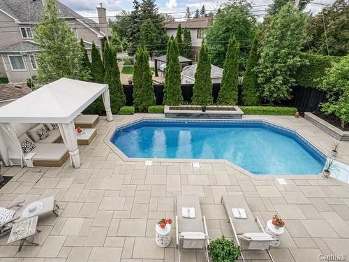 Cour - 32 Rue Du Chambertin, Kirkland, QC - Outdoor With In Ground Pool With Deck Patio Veranda