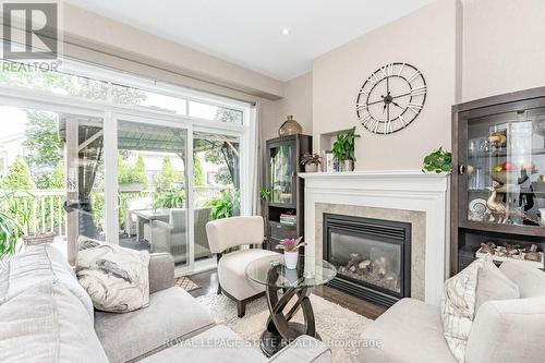 102 - 6186 Dorchester Road, Niagara Falls, ON - Indoor Photo Showing Living Room With Fireplace