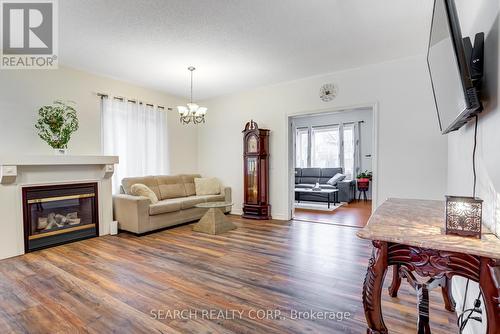 19 Treeline Blvd, Brampton, ON - Indoor Photo Showing Living Room With Fireplace