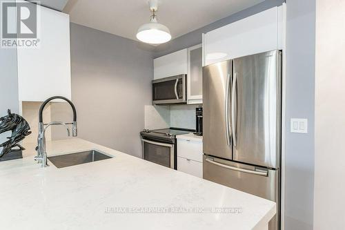 #209 -2391 Central Park Dr, Oakville, ON - Indoor Photo Showing Kitchen With Stainless Steel Kitchen