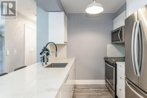 #209 -2391 Central Park Dr, Oakville, ON - Indoor Photo Showing Kitchen With Stainless Steel Kitchen With Upgraded Kitchen