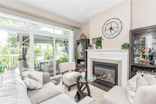 6186 Dorchester Road|Unit #102, Niagara Falls, ON - Indoor Photo Showing Living Room With Fireplace