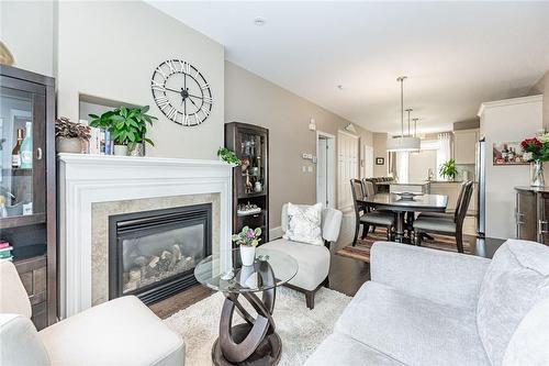 6186 Dorchester Road|Unit #102, Niagara Falls, ON - Indoor Photo Showing Living Room With Fireplace