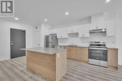 #407 -1098 Paisley Rd E, Guelph, ON - Indoor Photo Showing Kitchen With Double Sink