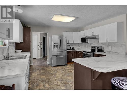 15720 E Thompson Road, Prince George, BC - Indoor Photo Showing Kitchen With Double Sink