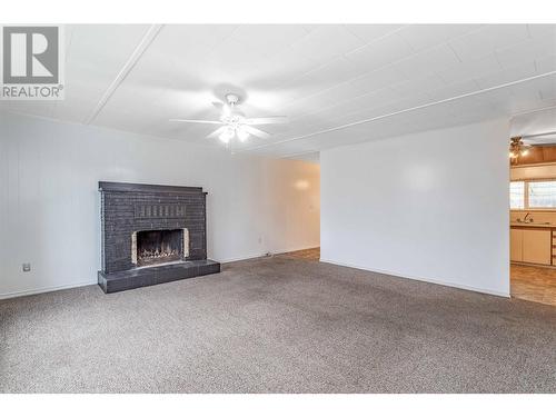 3338 Brun Road, Lake Country, BC - Indoor Photo Showing Living Room With Fireplace