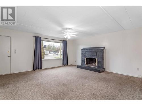 3338 Brun Road, Lake Country, BC - Indoor Photo Showing Living Room With Fireplace