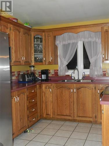 13 Dosco Hill, Bell Island, NL - Indoor Photo Showing Kitchen With Double Sink